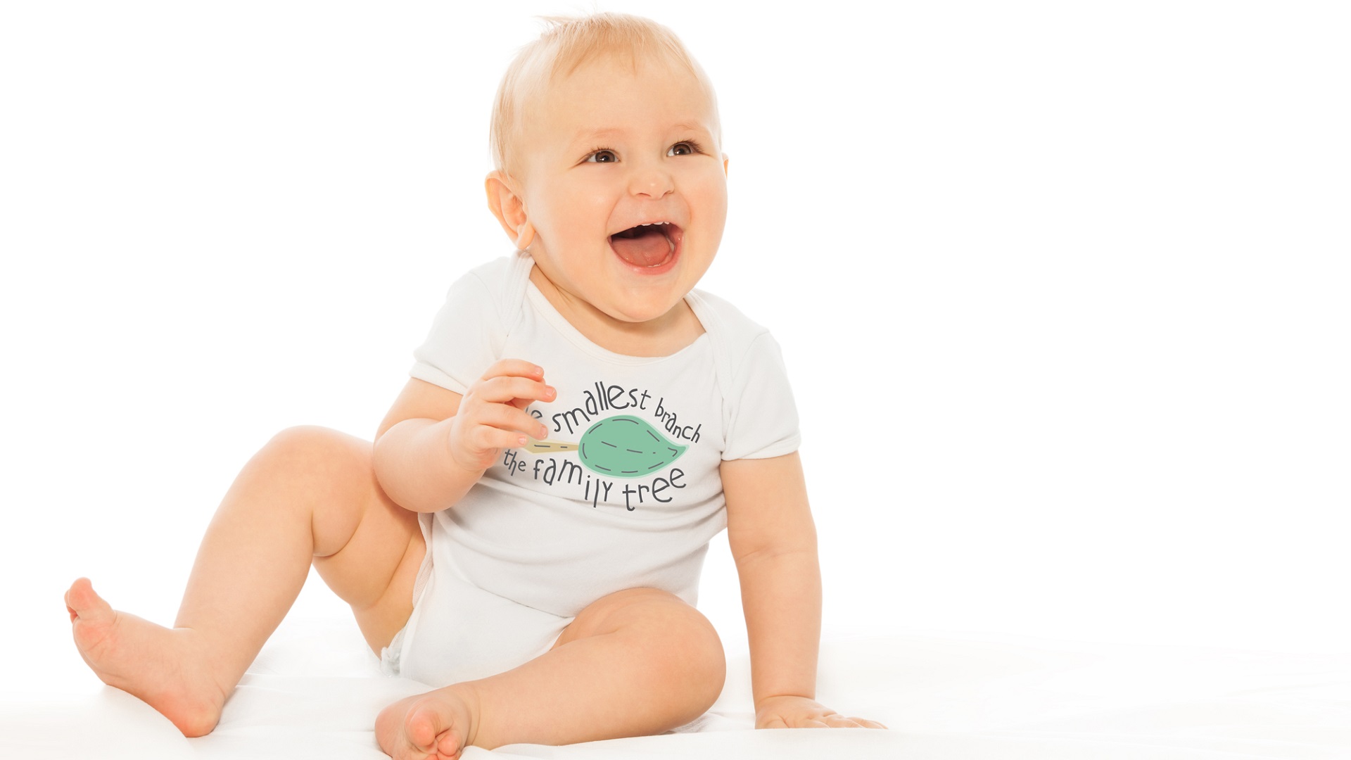 A laughing baby wearing an Itty Bitty Branch onesie