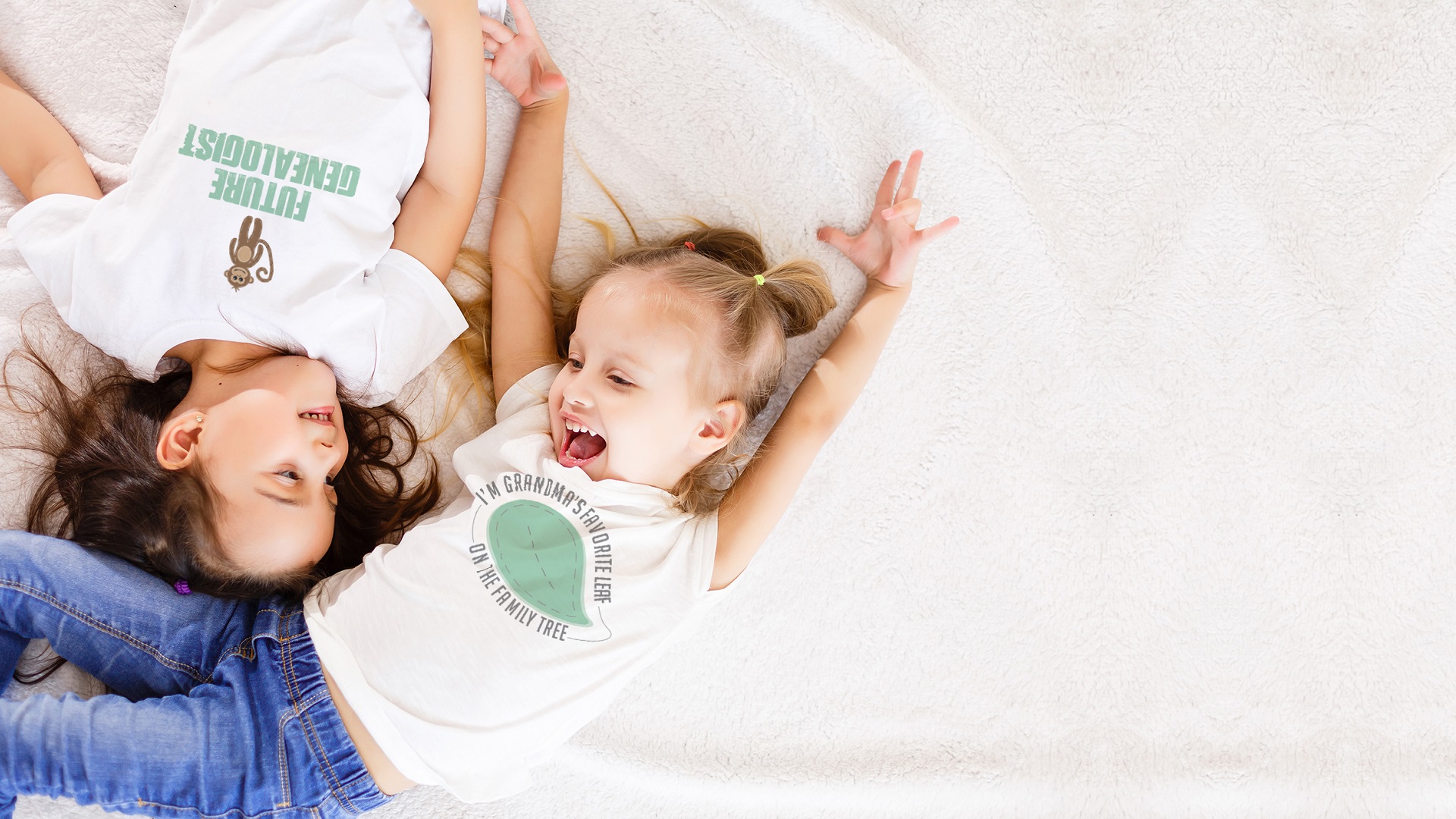 Two girls wearing Itty Bitty Branch shirts playing on the floor